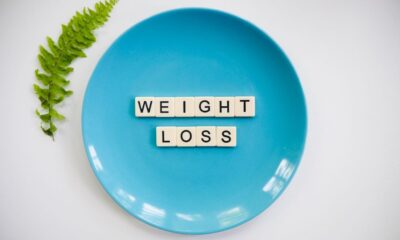 Weight loss on a blue plate spelt with scrabble letters