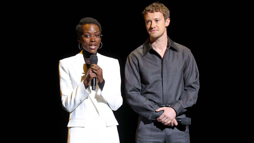 LAS VEGAS, NEVADA - APRIL 11: (L-R) Lupita Nyong'o and Joseph Quinn speak onstage at the Paramount Pictures Presentation during CinemaCon 2024 at The Colosseum at Caesars Palace on April 11, 2024 in Las Vegas, Nevada.  (Photo by Gabe Ginsberg/Getty Images)