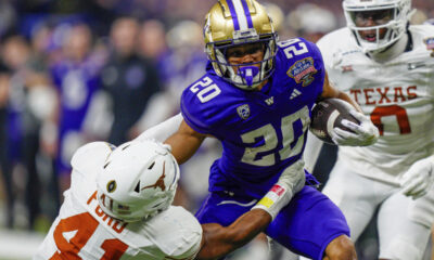 University of Washington football player arrested, charged with raping 2 women