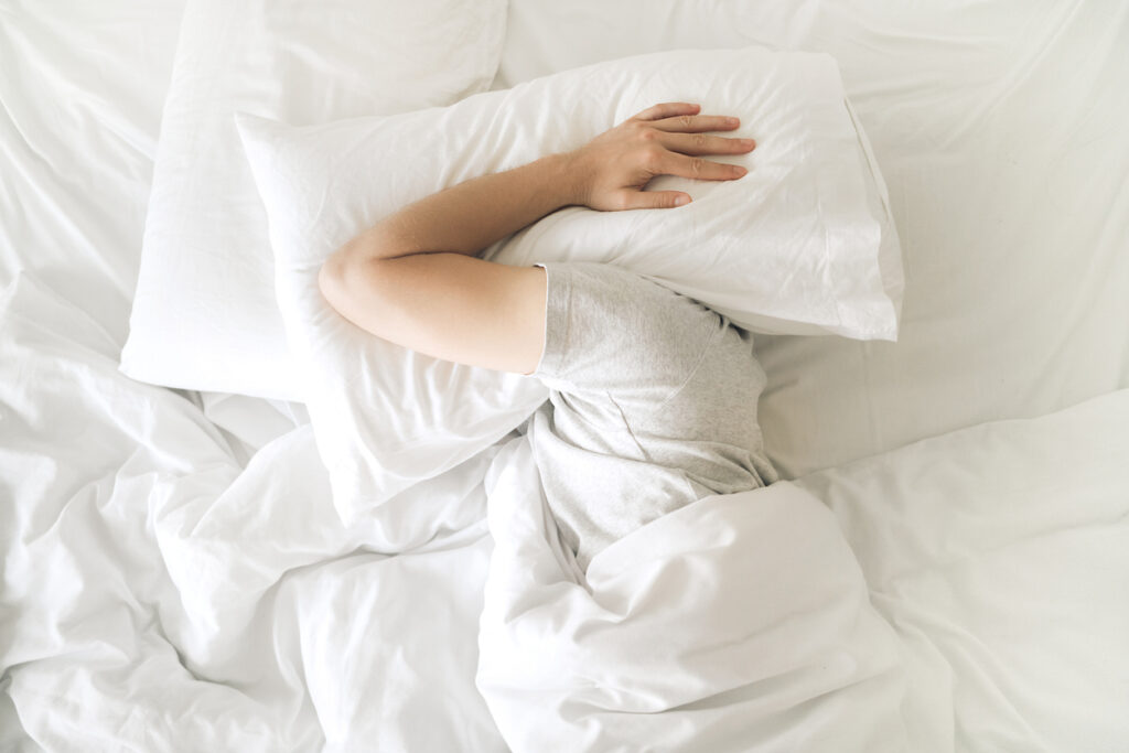 man struggling to sleep photograph