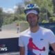 Djokovic greets fans with a helmet after being hit by bottle