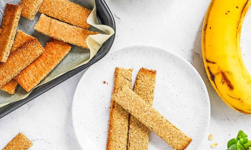 Healthy homemade baby teething biscuits recipe (baby crackers) on a white plate.