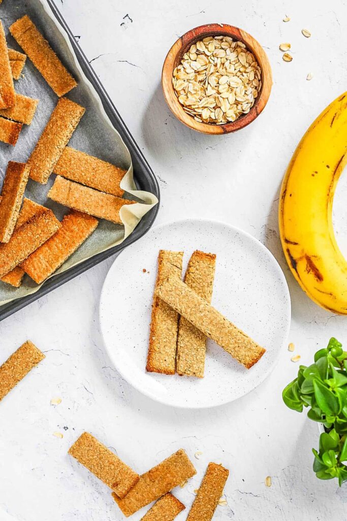 Healthy homemade baby teething biscuits recipe (baby crackers) on a white plate.