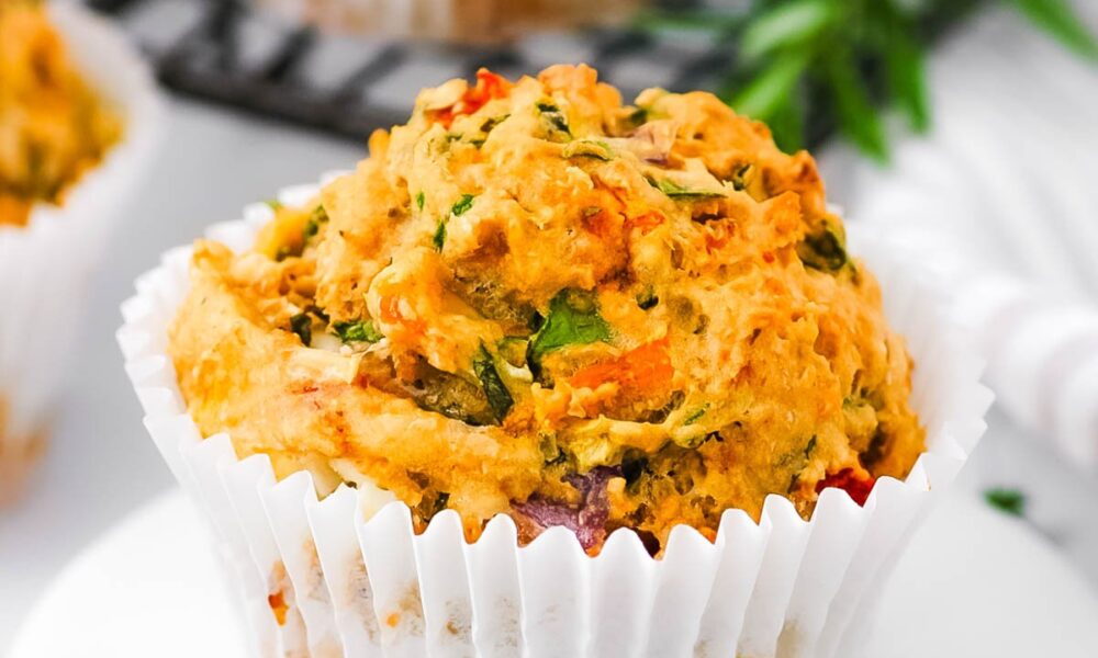 Savory vegetable muffins, served on a white plate.