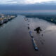 Body of a 5th victim is recovered from a submerged car after flooding in Germany