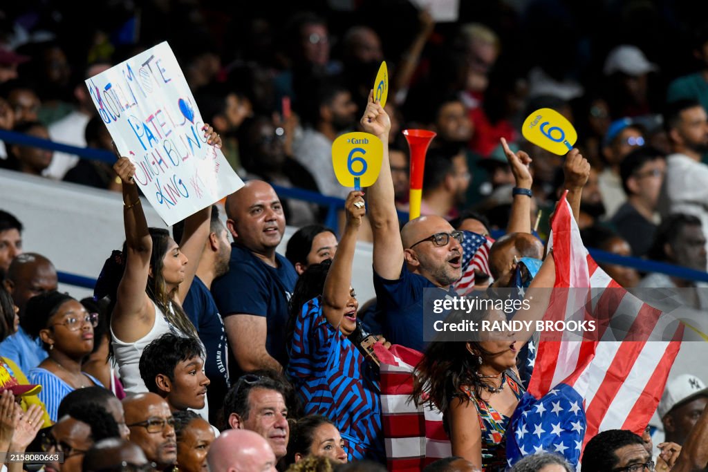 Supporters of USA cheer for their team during the ICC men