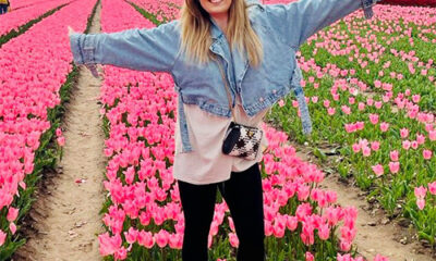 Kirsty in a field of pink tulips