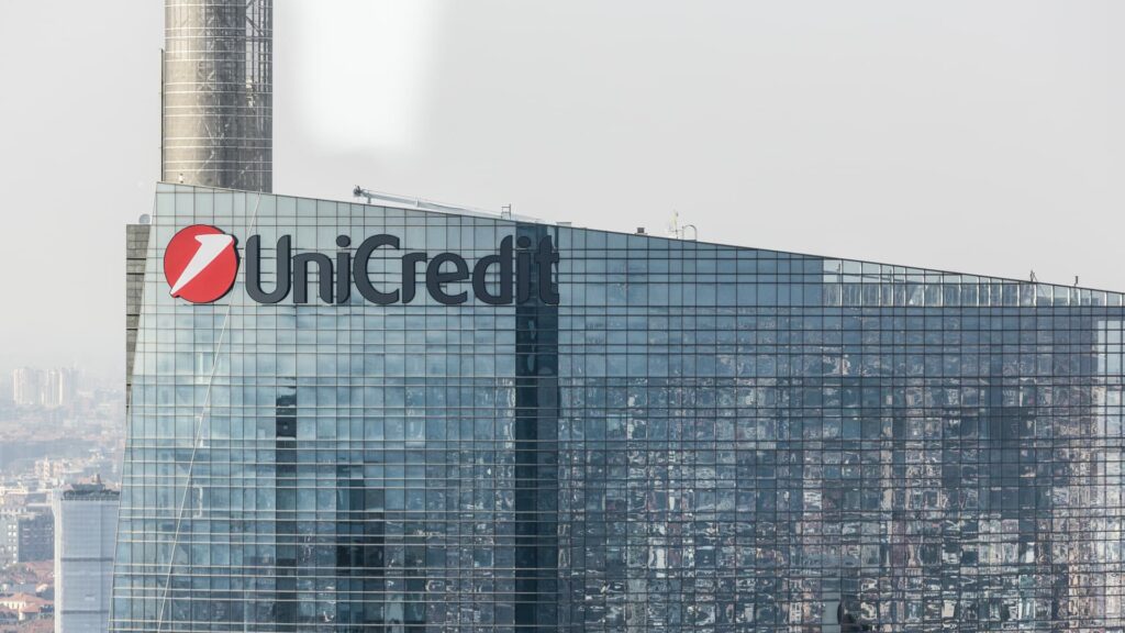 UniCredit tops profit forecast, buys cloud-based bank