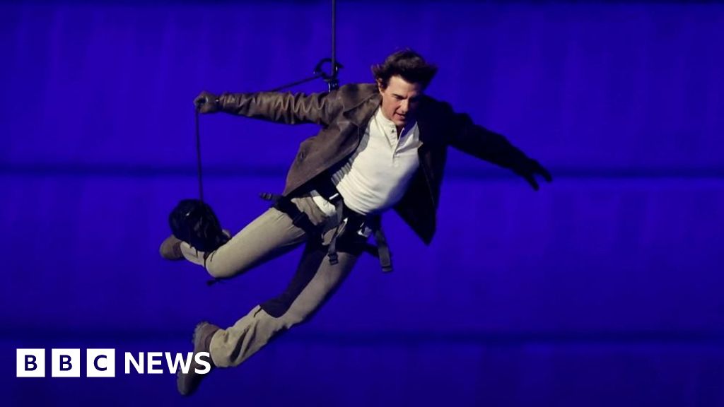 Tom Cruise abseils off stadium roof in daring Olympic finale