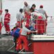 Rescuers carry a body after divers return to Porticello harbor near Palermo, three days after the British-flagged luxury yacht Bayesian sank. - Alberto Pizzoli/AFP/Getty Images