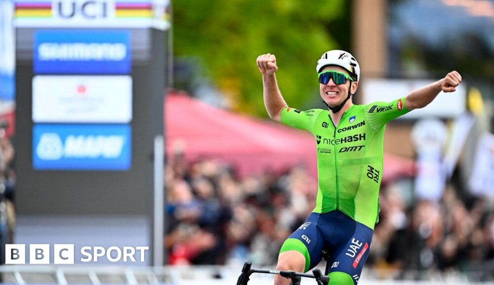 Tadej Pogacar: Slovenian wins first world road race title to complete cycling's 'Triple Crown'